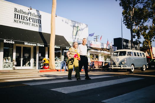 Senior couple crossing the street in Newport Beach, embracing leisure and togetherness.